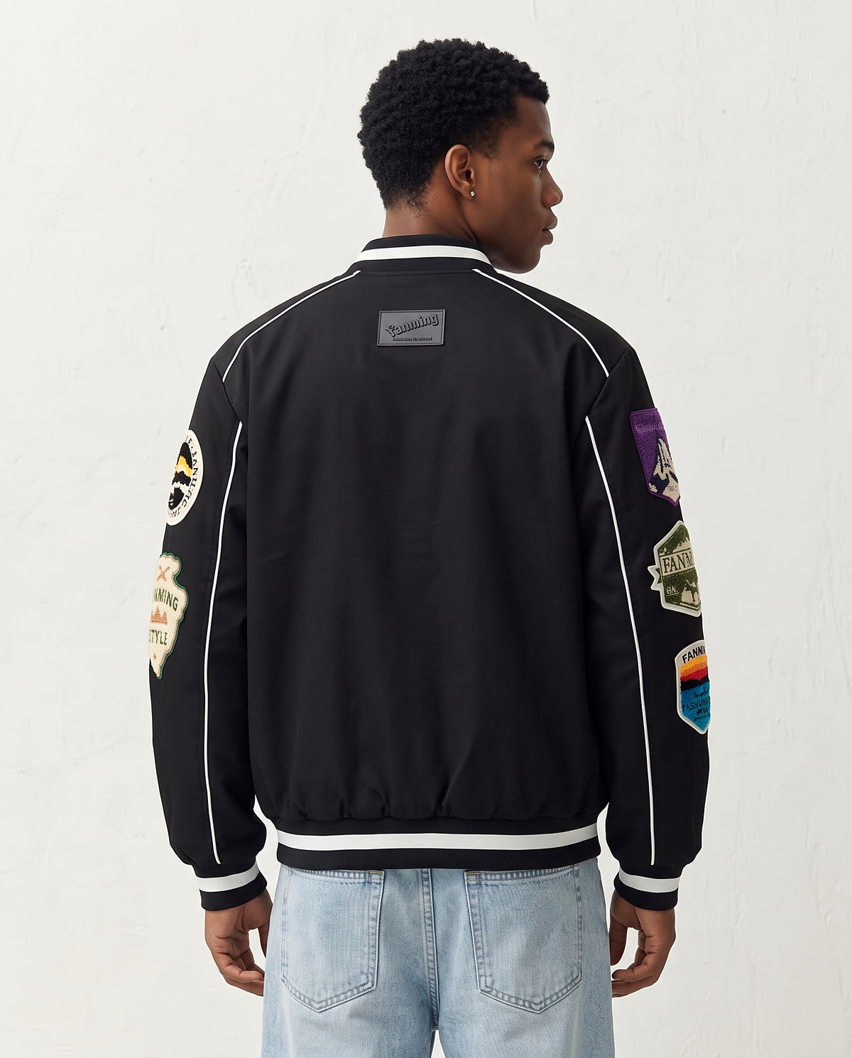Veste style baseball noire vue de dos