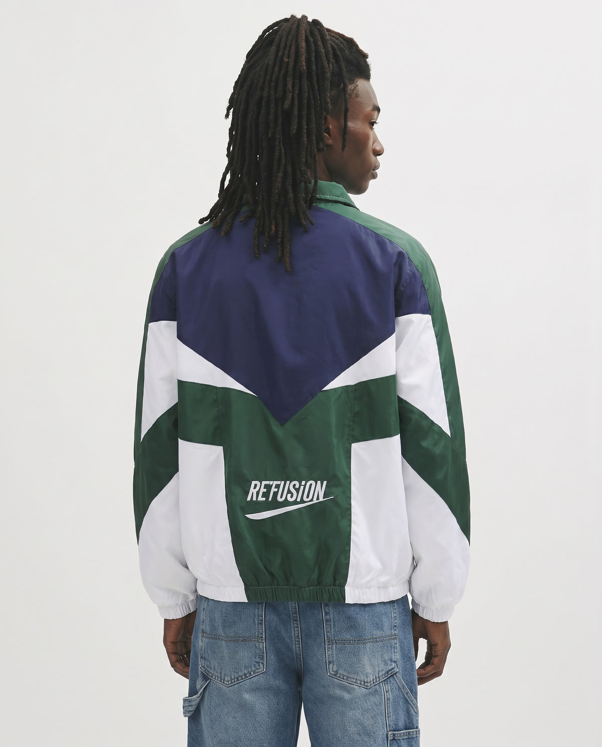 Veste universitaire vintage bleue et verte vue de dos